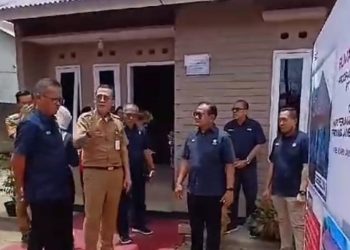 Kadis Kominfo Ariansyah Gunting Pita Bedah Rumah Bantuan PT. Semen Padang